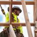 Worker wearing Lift Safety Radix full brim helmet on construction jobsite framing