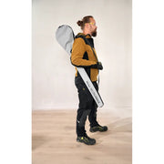 Worker carrying Mirka DecoSander in its shoulder carrying case — lightweight portable sander kit