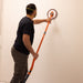 User sanding ceiling with Radius360 Dust-Free Conversion Kit attached to dust-extraction vacuum