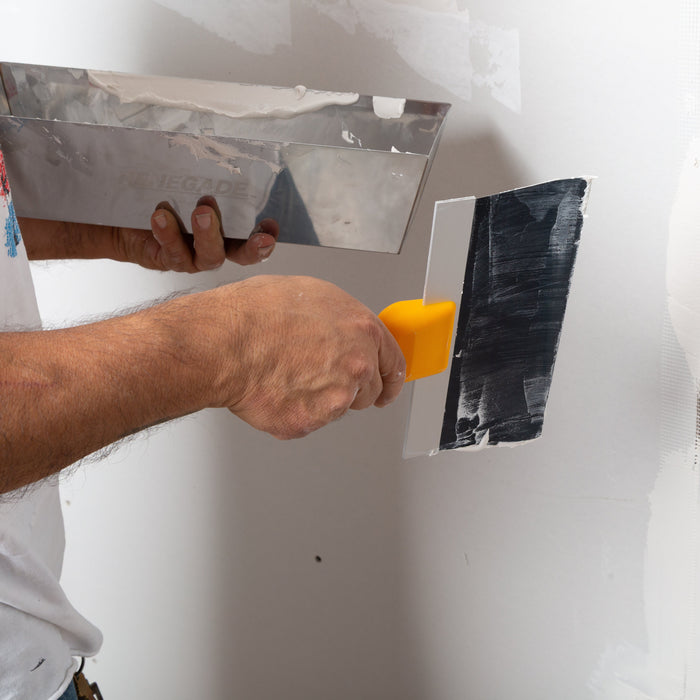 Renegade mud pan and blue steel taping knife applying joint compound to drywall seams