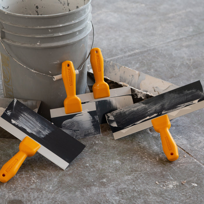 Renegade blue steel drywall taping knife set with stainless steel mud pans on active jobsite