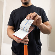 Flex Edge 2.0 with sanding sheets clipped on, showing abrasive screen enabled by heavy-duty clips