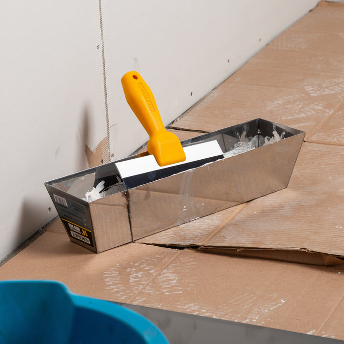 Renegade drywall mud pan with blue steel taping knife and joint compound on jobsite