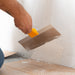 Renegade stainless steel drywall taping knife feathering joint compound on taped seam