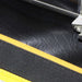 Close-up of TapeTech MudRunner padded carrying case interior with MudRunner tool and yellow nylon lining